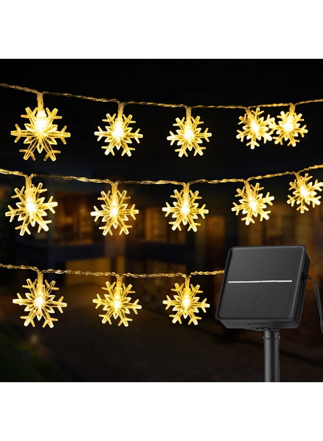 برايتاون سلسلة أضواء ندفة الثلج الشمسية من Brightown، 100 مصباح LED بطول 39 قدمًا، مصابيح خرافية خارجية مقاومة للماء مع 8 أوضاع إضاءة لحفلات الزفاف والحفلات والأشجار والغرف والحدائق والفناء والمنزل، باللون الأبيض الدافئ - Image 1