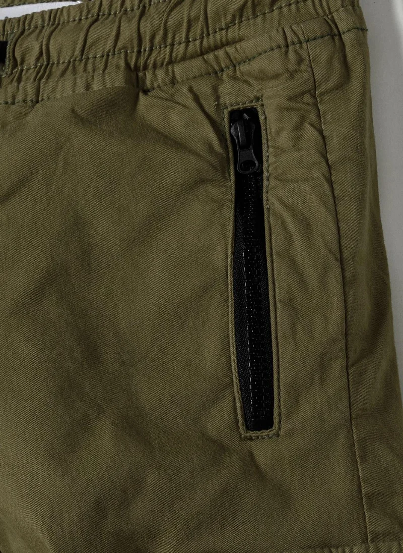 MINOTI Teen Boys Cargo Trousers with Zipped Pockets and a Print