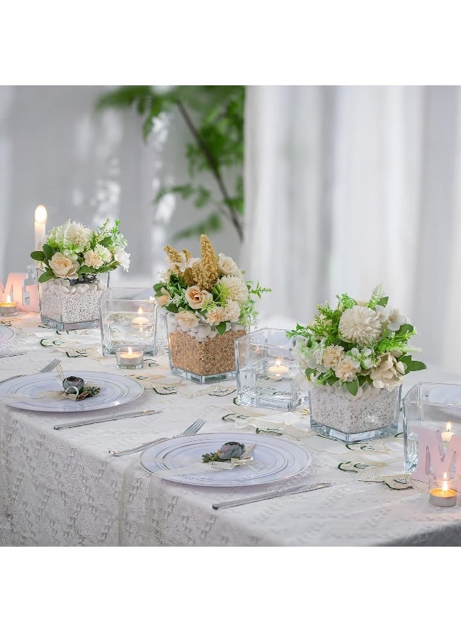 Clear glass square vases with various decorative uses plants, candles, table