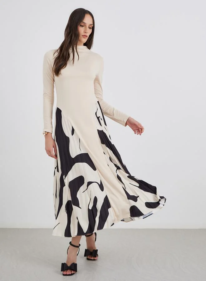 ستايلي فستان ميدي بتفاصيل كسرات وأكمام طويلة