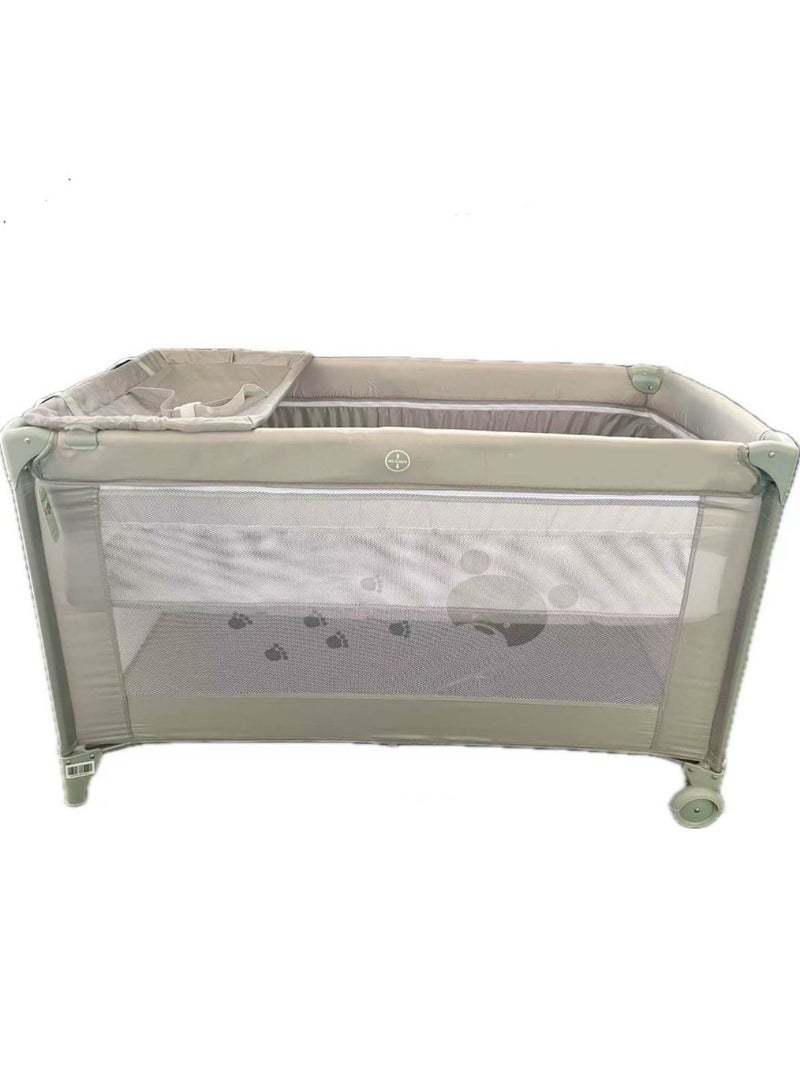 A baby bed a double playpen and a diaper changing table