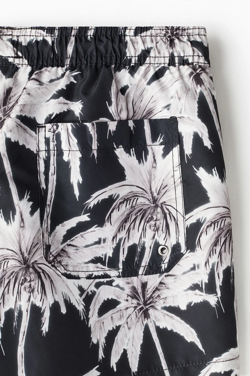 اتش اند ام شورت سباحة مزيّن بنقوش