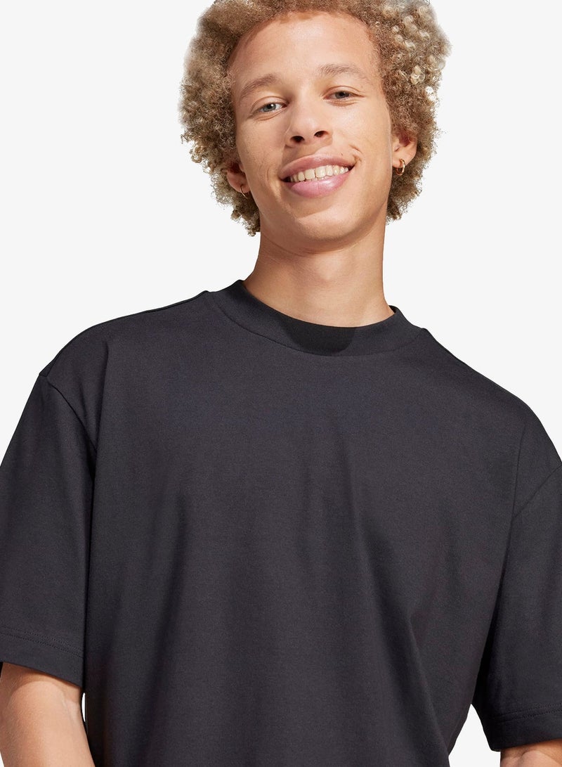 اديداس تيشيرت أساسي بقصة فضفاضة وشعار ثلاثة خطوط - Image 4