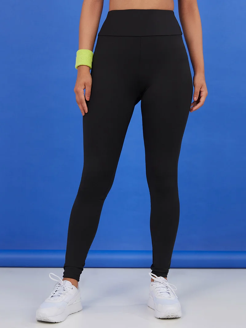 Styli Active Open Back Mesh Insert Printed Elastic Active Crop Top and Leggings Active Set