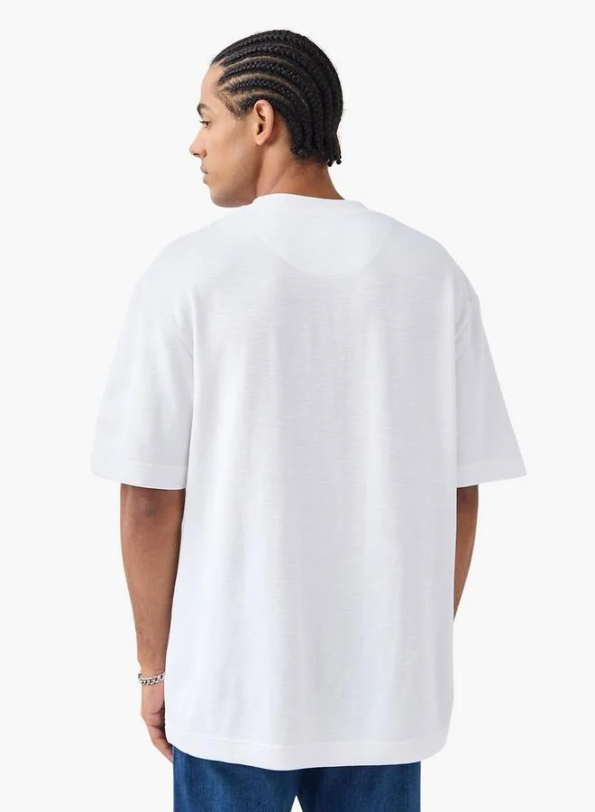 لي كوبر تيشيرت فضفاض بأكمام قصيرة وياقة ضيقة من  لي كوبر