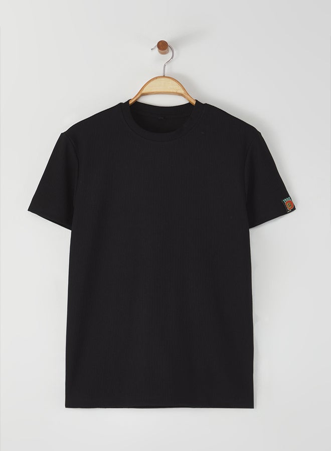 trendyol Black Regular Cut Textured T-Shirt with Label Detail - Image 1