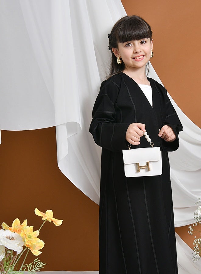 HAWRAA ABAYA Ratal Abaya | Black daily closed with snaps decorated with black ribbons - Image 3
