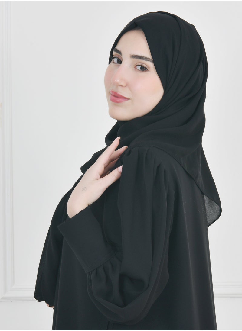 HAWRAA ABAYA - Black quarter-length abaya with narrow, practical sleeves that close with snaps - Image 1