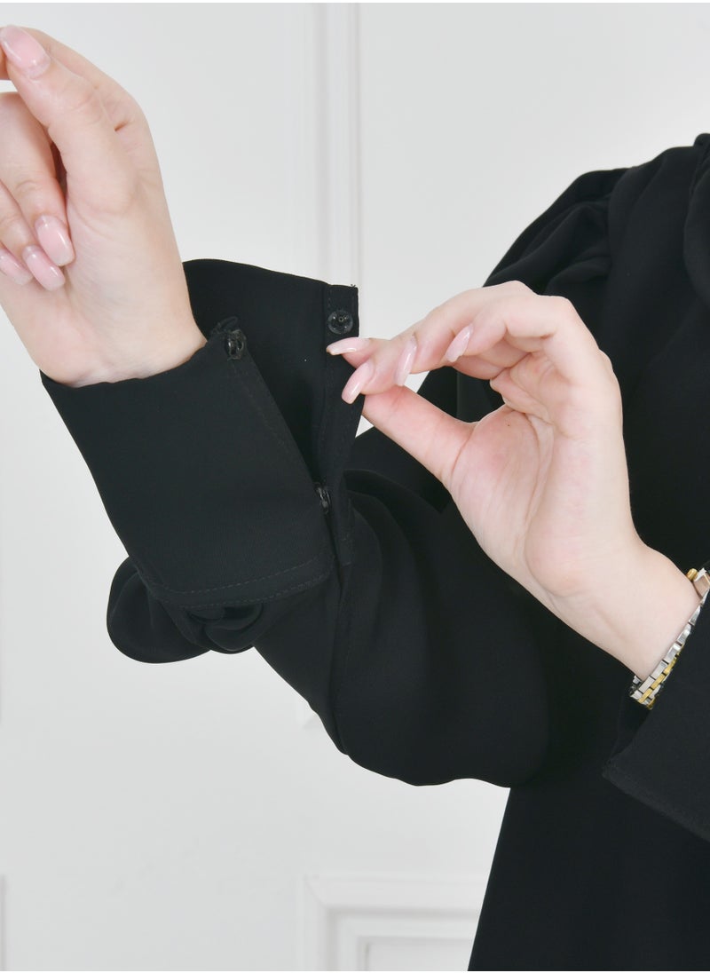 HAWRAA ABAYA - Black quarter-length abaya with narrow, practical sleeves that close with snaps - Image 1