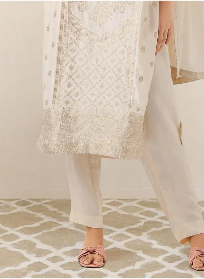 ISHIN Cream Women Cream Poly silk Kurta Set with Embroidered pattern Tunic and Palazzo features a Round neckline and Three-Fourth Sleeve secured with Elastic closure and styled in Straight Fit ideal for Festive moments — perfect for fashion-forward occasions.