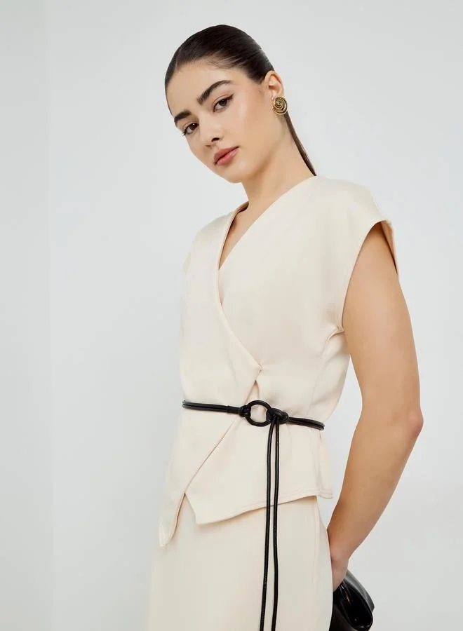 Styli Off-White Sleeveless Wrap Top with Matching Skirt