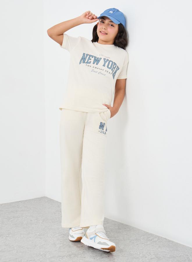 ستايلي طقم تيشيرت فضفاض بطبعة شعار أوف وايت وبنطلون رياضي واسع للبنات - Image 1