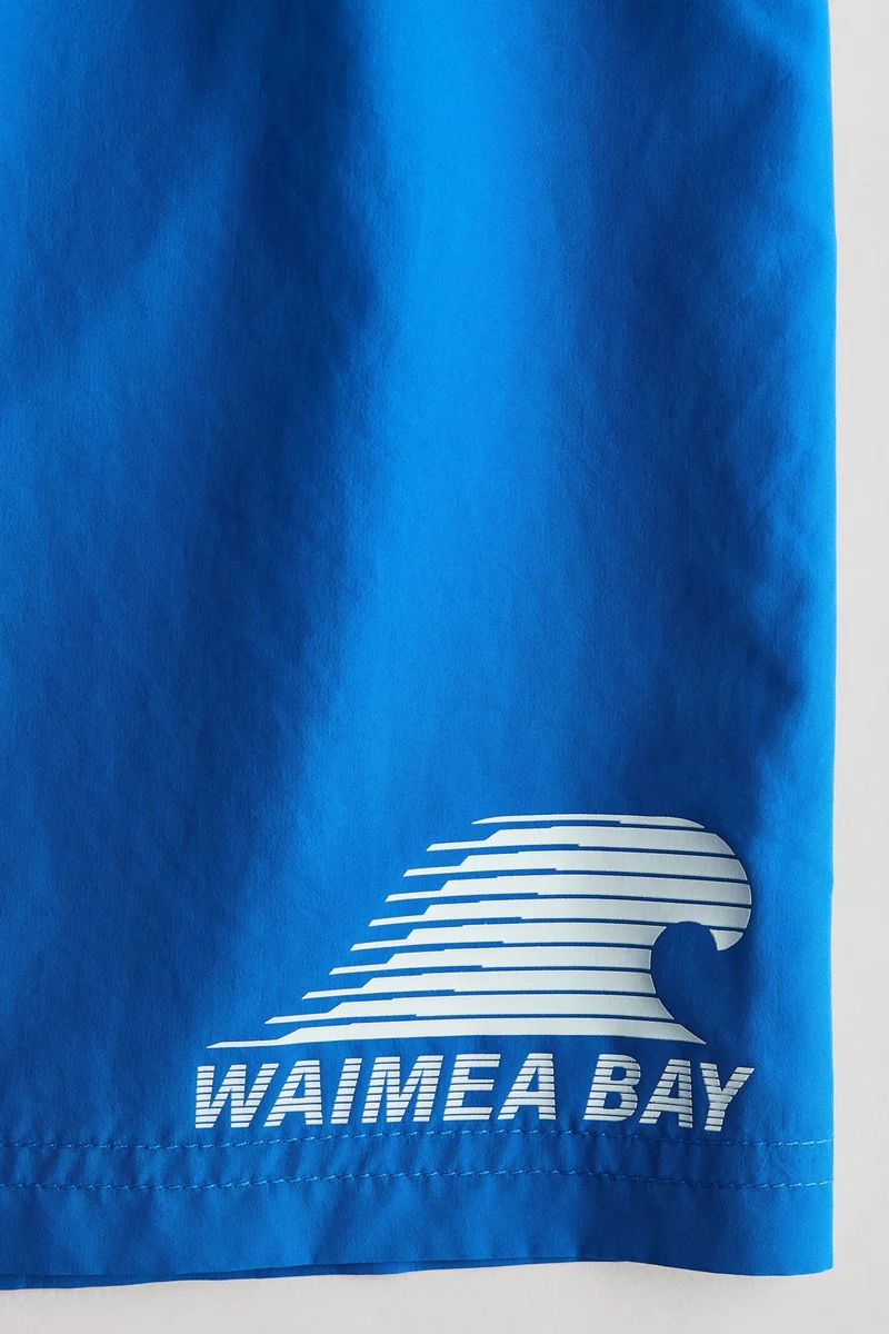 اتش اند ام شورت سباحة مُزين بطبعة