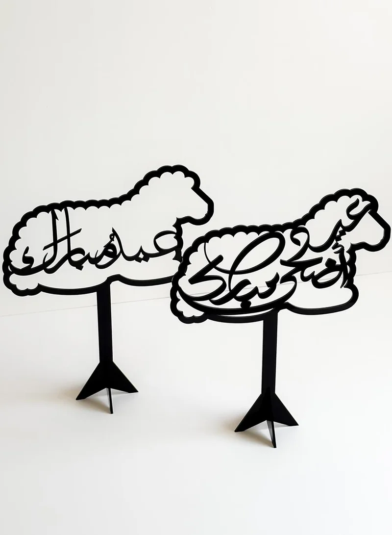 LOWHA Set of Two Acrylic Decor Stands in the Shape of a Sheep with the Arabic Phrase Eid Adha Mubarak Inside