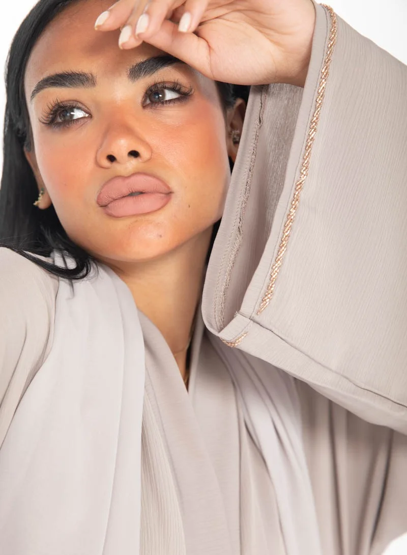 Aara Beige Abaya with Pleats and Gold Embellishments