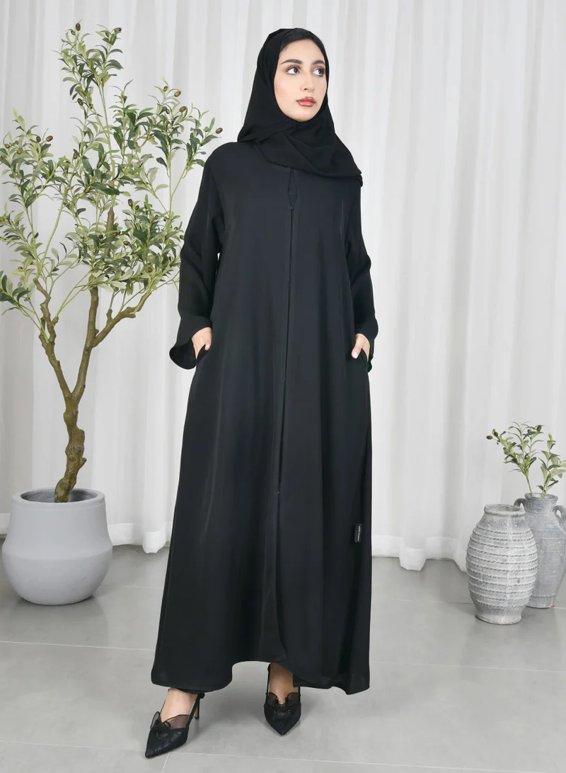 HAWRAA ABAYA Black abaya with quarter cloche closure and hidden pockets