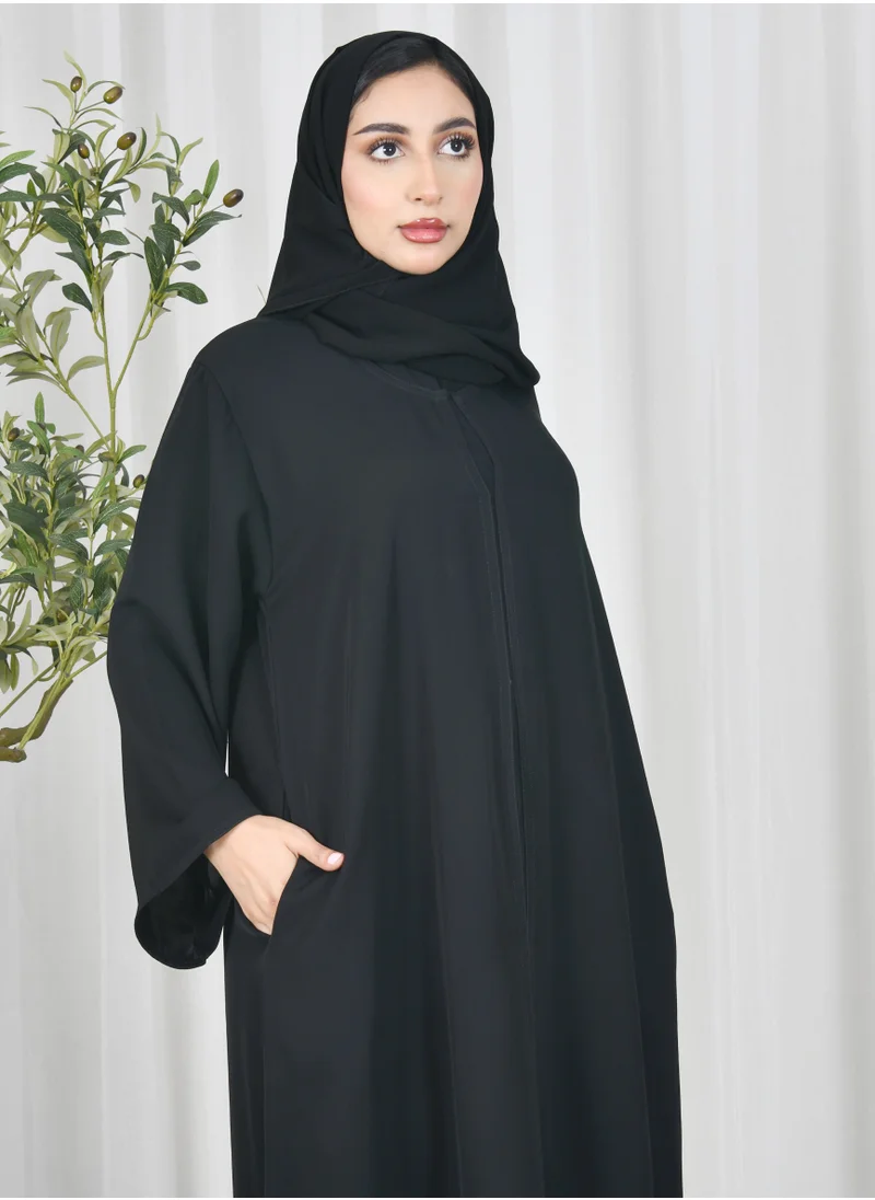 HAWRAA ABAYA Black abaya with quarter cloche closure and hidden pockets