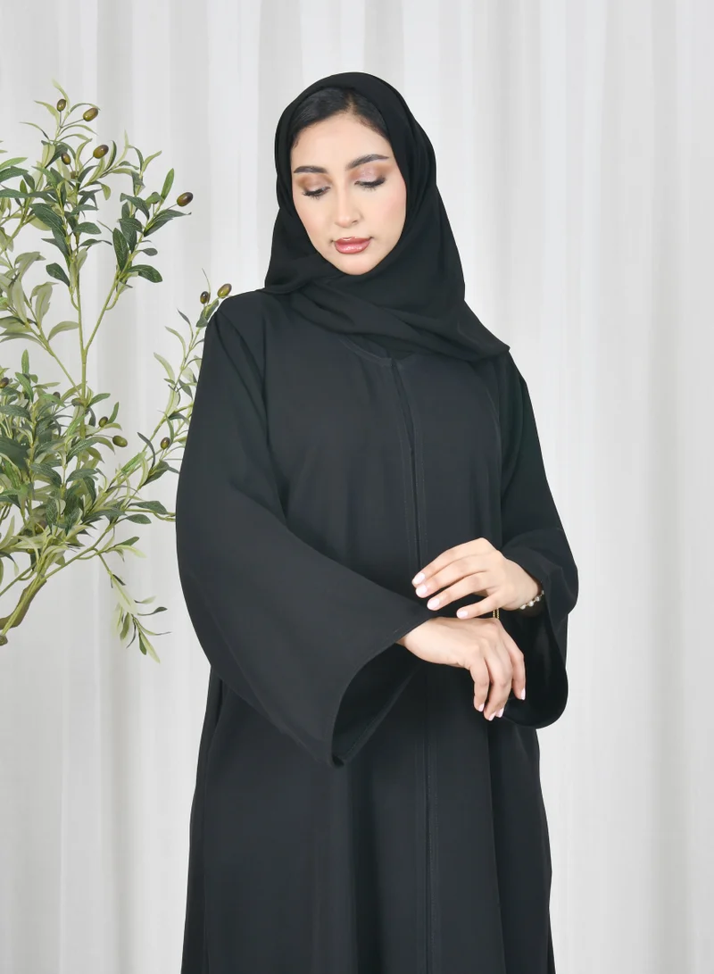 HAWRAA ABAYA Black abaya with quarter cloche closure and hidden pockets