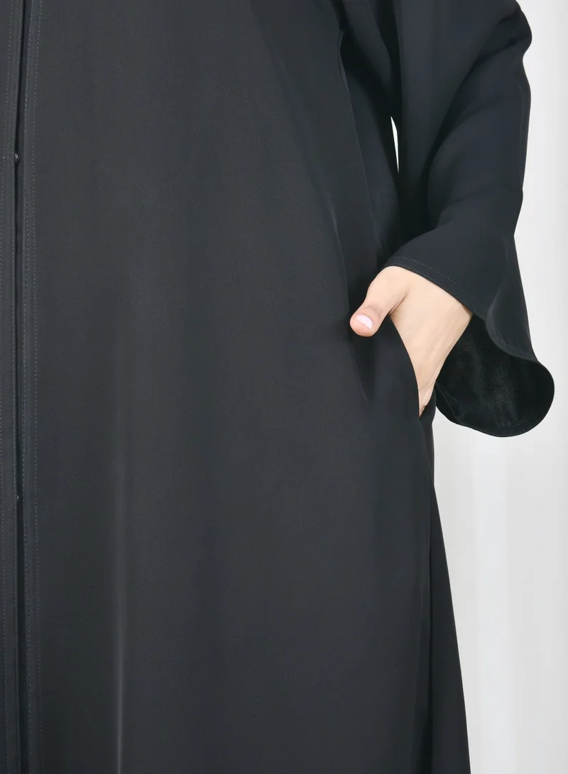 HAWRAA ABAYA Black abaya with quarter cloche closure and hidden pockets