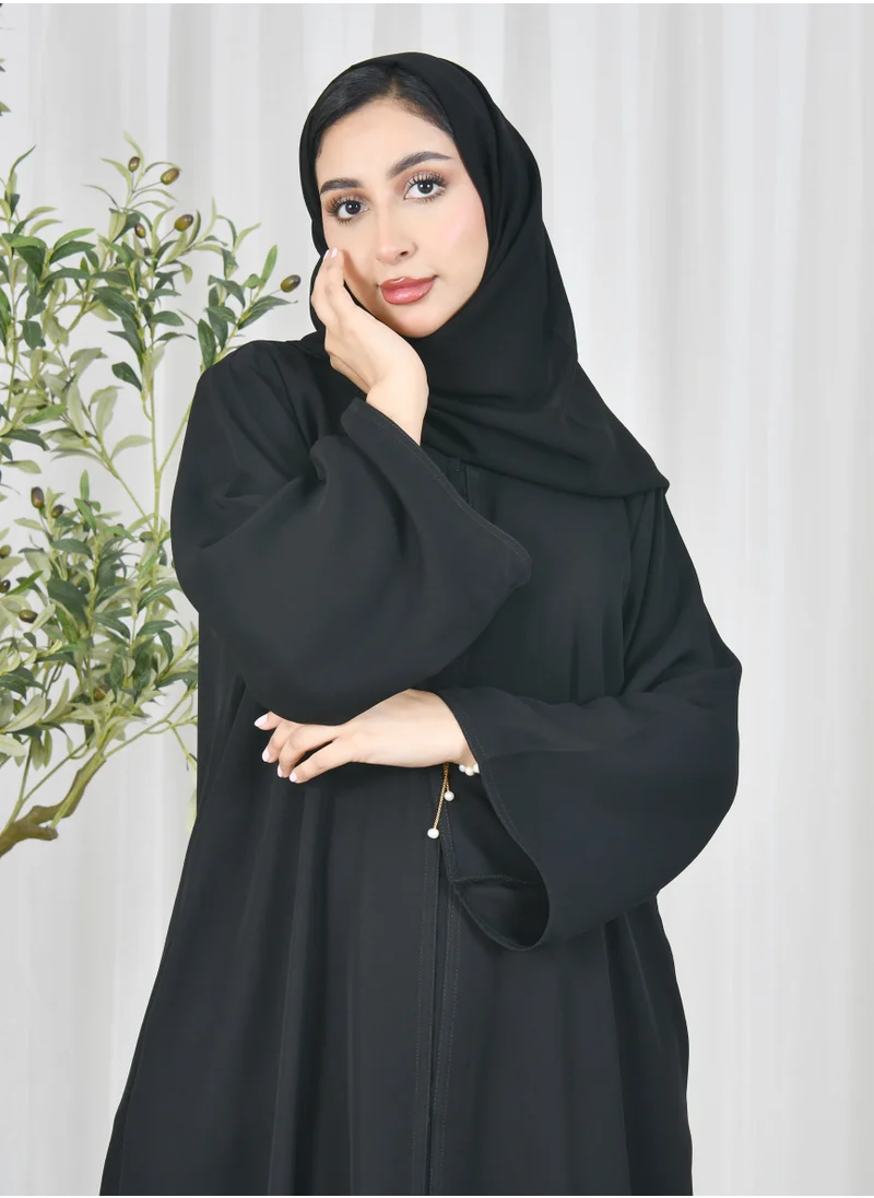 HAWRAA ABAYA Black abaya with quarter cloche closure and hidden pockets
