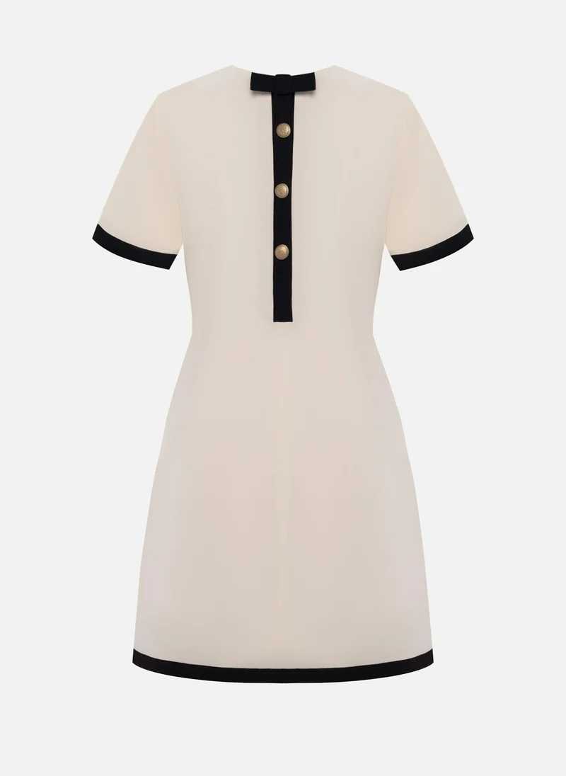 Lichi Mini dress with contrasting details and back decoration