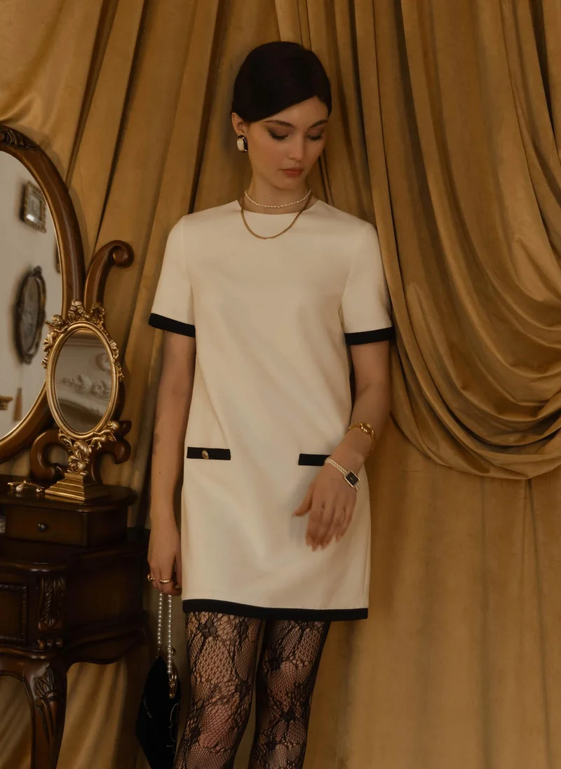 Lichi Mini dress with contrasting details and back decoration