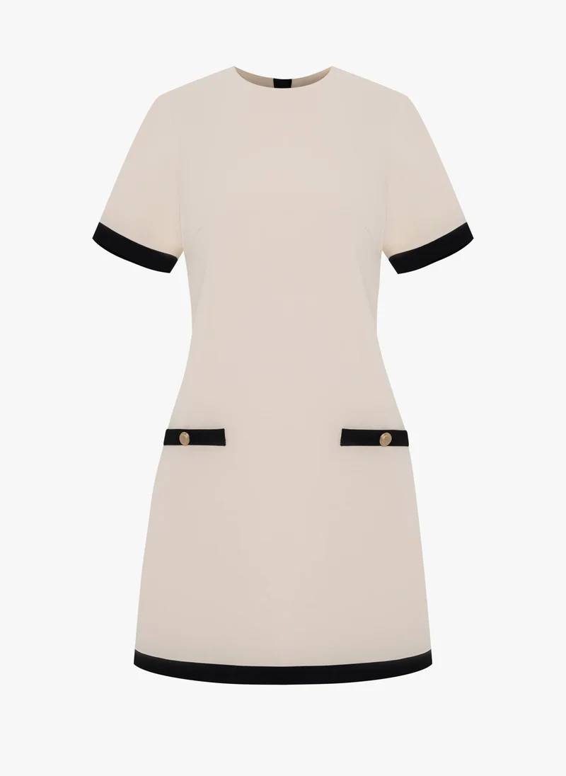 Lichi Mini dress with contrasting details and back decoration