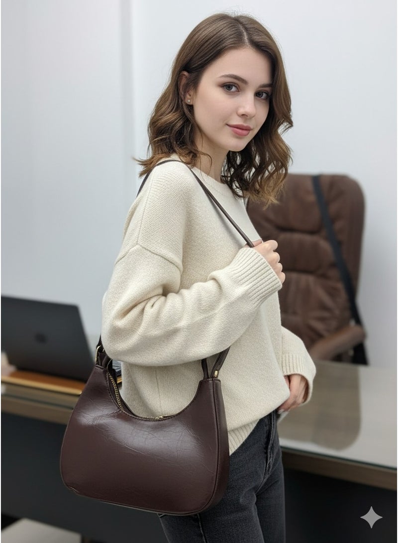 Vbranda Stylish shoulder bag with a modern design and glossy finish featuring a zip closure. - Image 1