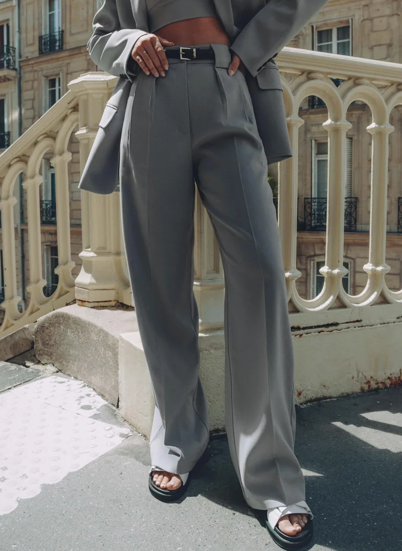 Lichi Palazzo trousers with pleats at the waist and contrasting button