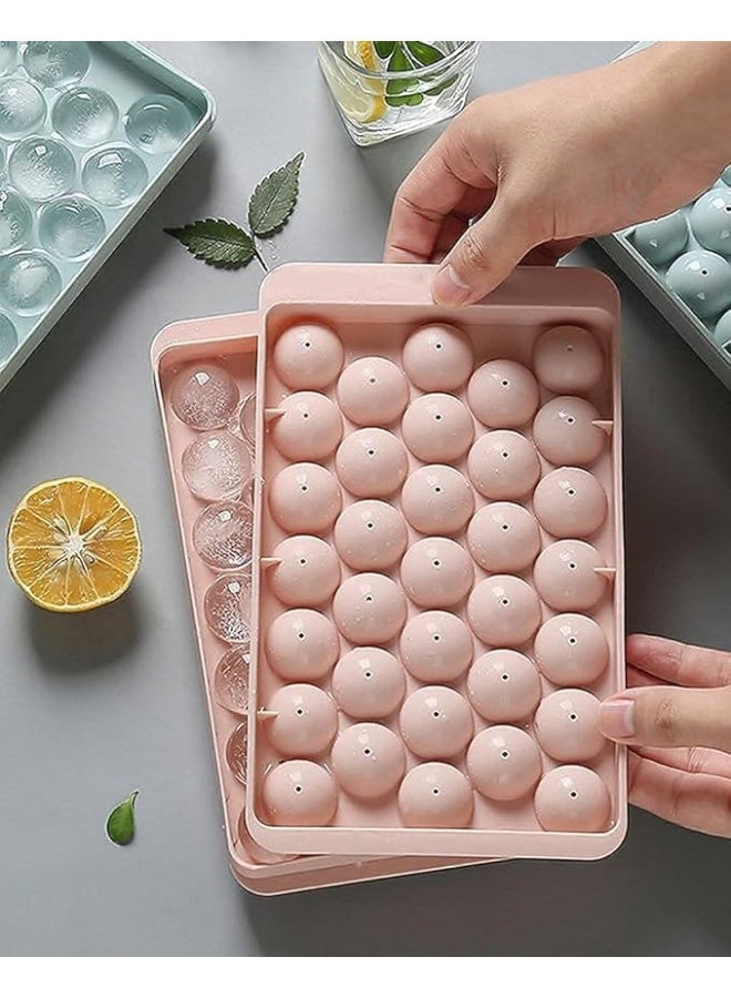 Clazkit قالب مكعبات ثلج بلاستيكية صغيرة مستديرة من Clazkit مع غطاء لصنع كرات الثلج للعصائر الطازجة، والموكتيلات، والويسكي، والكوكتيلات، والشاي، والقهوة. يحتوي على 33 تجويفًا، سهل الفتح، قابل للتكديس في المجمد. عبوة من قطعتين، أزرق، وردي. - Image 1