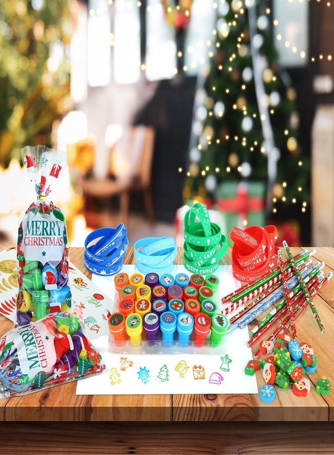 Kesote Christmas Stocking Stuffers Party Favors Stationery for Kids, 144pcs 24 Pack Christmas Goodie Bag Fillers Including Pencils, Wristbands, Stickers, Stamps and Erasers in Treat Bags - Image 4