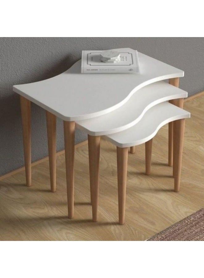 A set of 3 white tables with elegant wavy wooden legs, featuring a modern and unique design.
