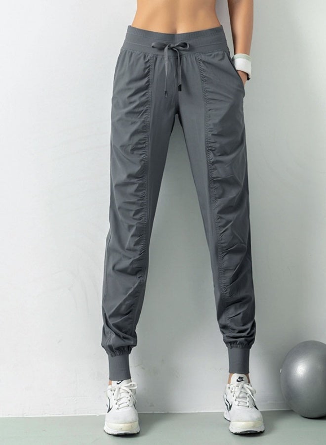 NIBEMINENT Women's Athletic Training Leggings For Yoga And Fitness, Featuring Nine Pockets And a Casual Bundle Foot Guard Design - Image 1