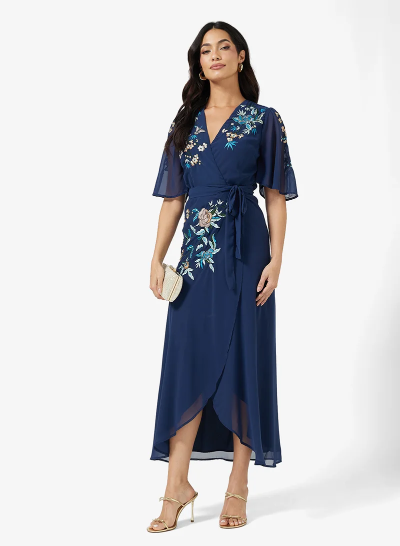 هوب اند ايفي Embroidered Flutter Sleeve  Tie Waist Detail Wrap Maxi Dress