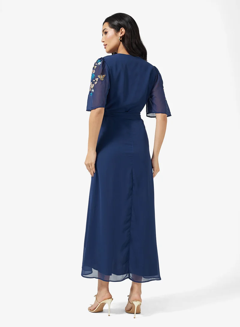 هوب اند ايفي Embroidered Flutter Sleeve  Tie Waist Detail Wrap Maxi Dress