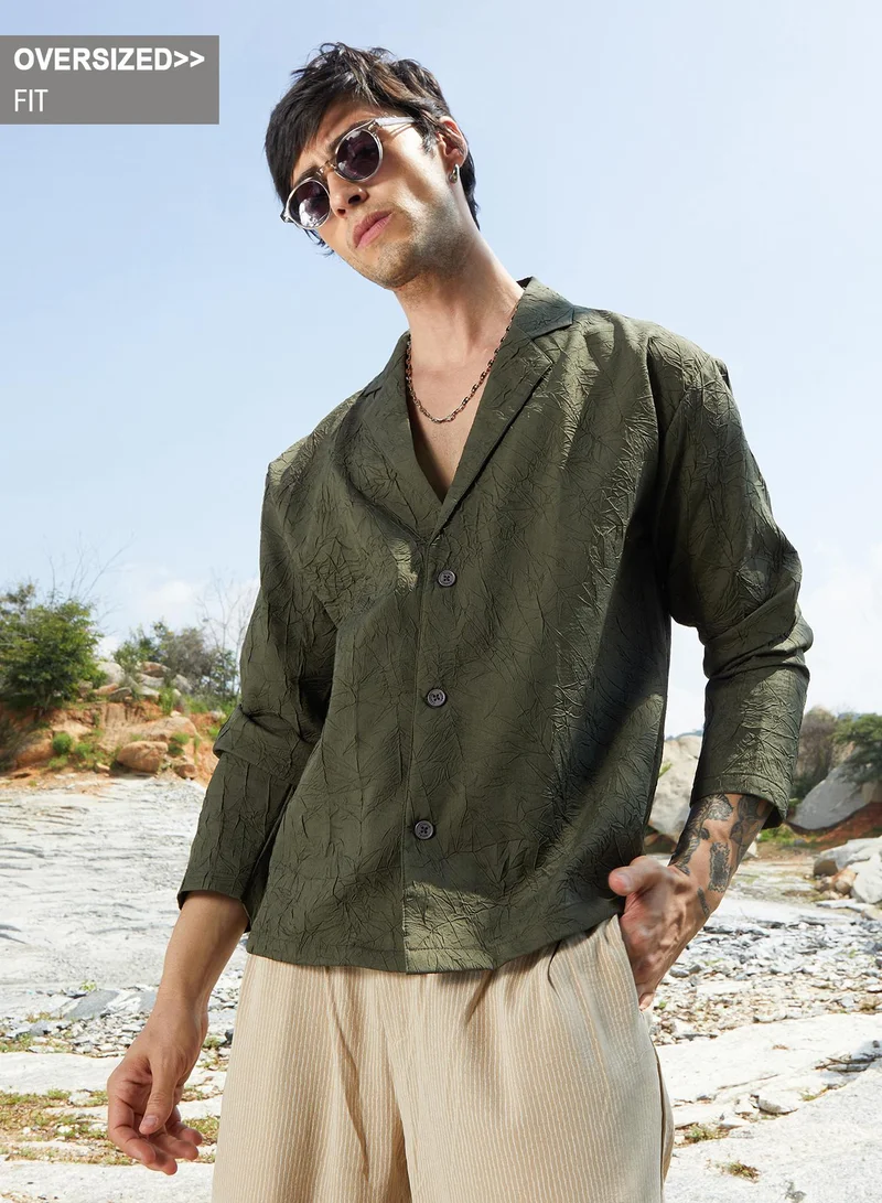 Campus Sutra Campus Sutra Men's Army Green Wrinked Korean Oversized Shirt For Casual Wear | Lapel Collar | Long Sleeve | Button Closure | Oversized Shirt Crafted With Comfort Fit For Everyday Wear