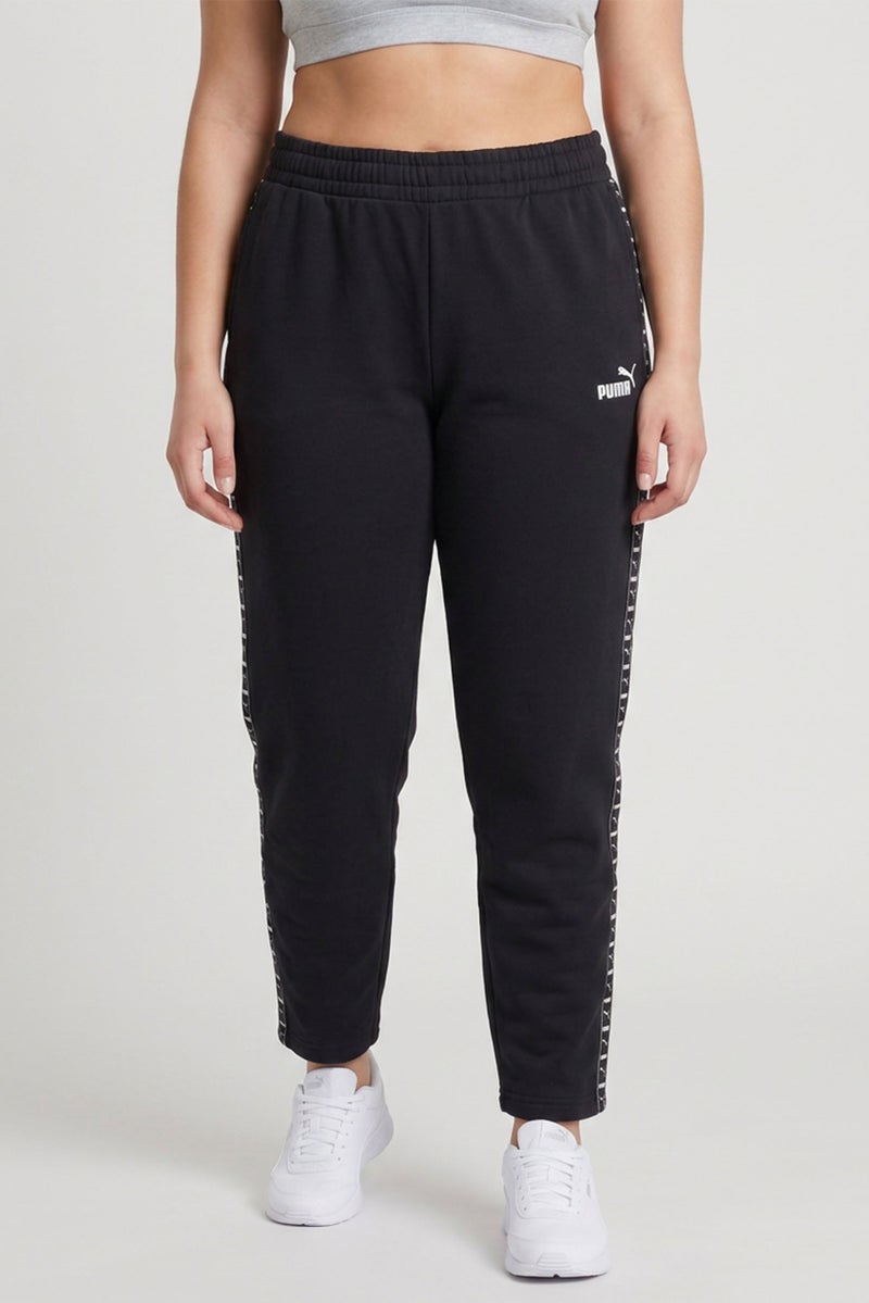 PUMA Women Sportswear Fit Brand Logo Outdoor Sweatpants, Black - Image 1