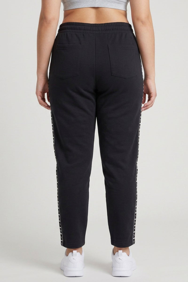 PUMA Women Sportswear Fit Brand Logo Outdoor Sweatpants, Black - Image 4