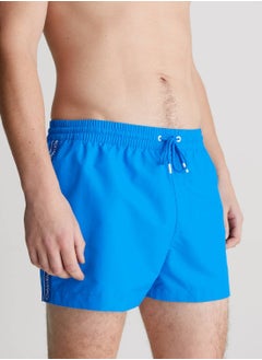 CALVIN KLEIN Men's Short Drawstring Swim Shorts - Logo Tape - Polyester, Blue  - Image 1