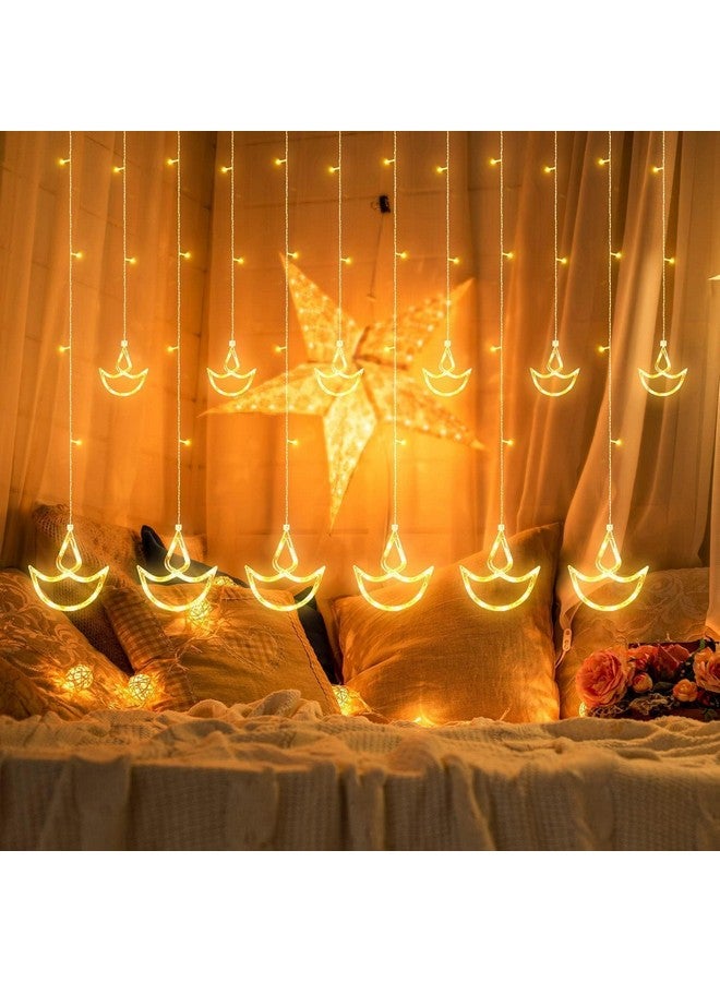 FLYNGO FLYNGO 12 Diya 138 LED Curtain String Lights for Decoration, Window Lights with 8 Flashing Modes for Home Decoration for Diwali, Wedding, Party, Christmas, Balcony - Warm White (Diya) (Diya)  - Image 1