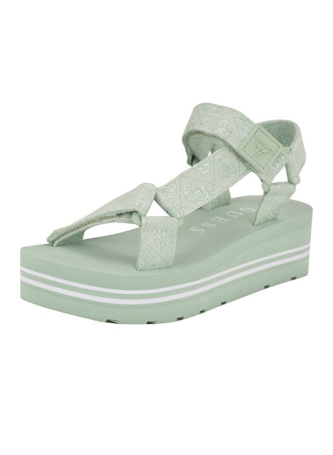 GUESS صندل أفين ويدج للنساء من غيس، أخضر فاتح/شعار أبيض 330، 38 EU - Image 1