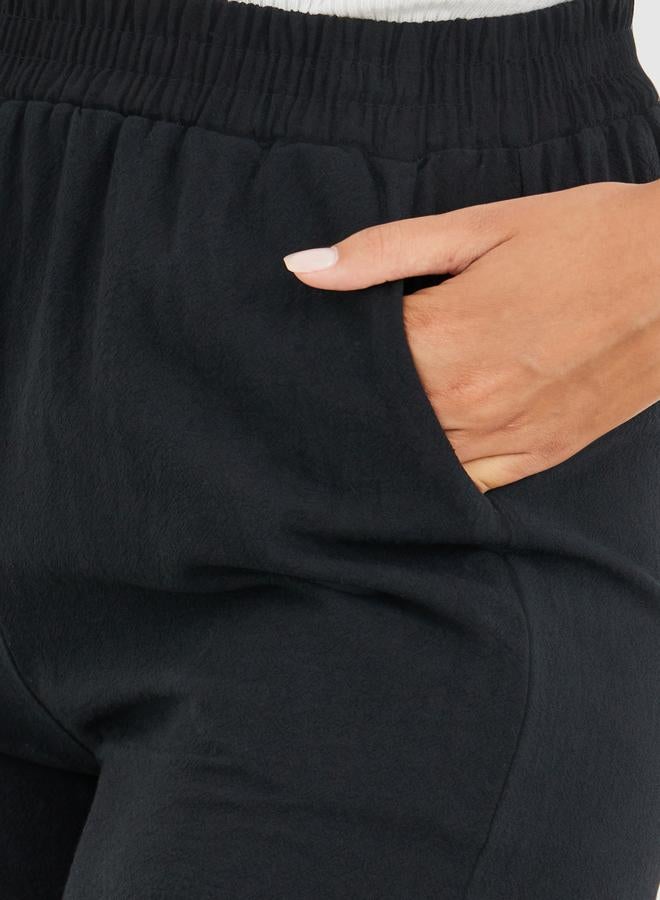 تايك تو شورت واسع بخصر متوسط بلون سادة - Image 3