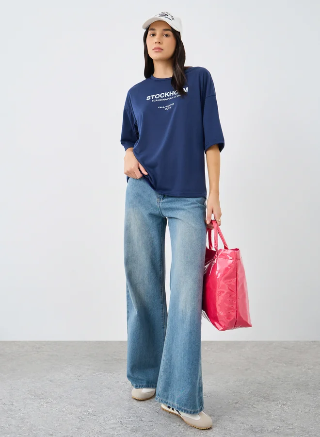 ستايلي Styli Slogan Print Round Neck Oversized T-Shirt