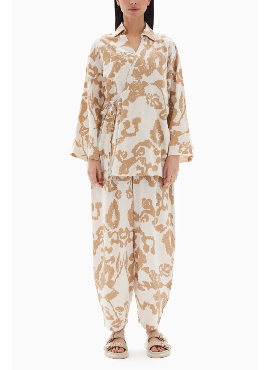 Wecre8 Beige Abstract Printed Set of Blouse with Trousers By WECRE8