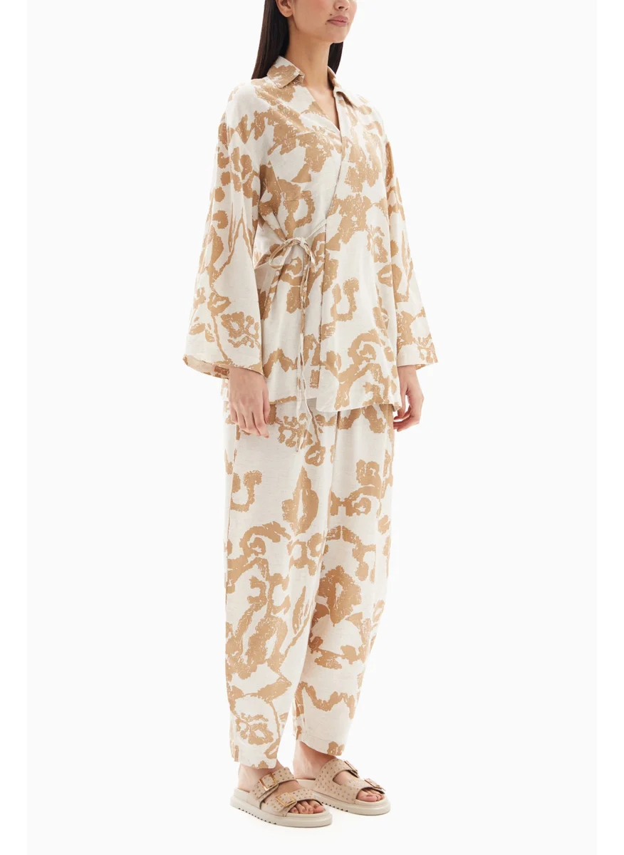 Wecre8 Beige Abstract Printed Set of Blouse with Trousers By WECRE8