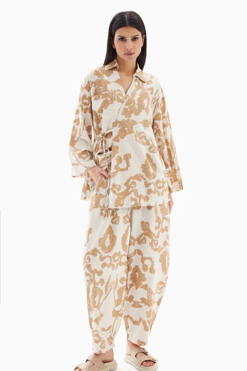 Wecre8 Beige Abstract Printed Set of Blouse with Trousers By WECRE8
