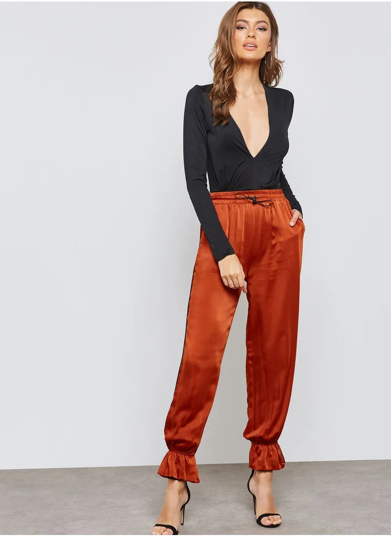 Ginger Ruffle Hem Satin Jogger Pants