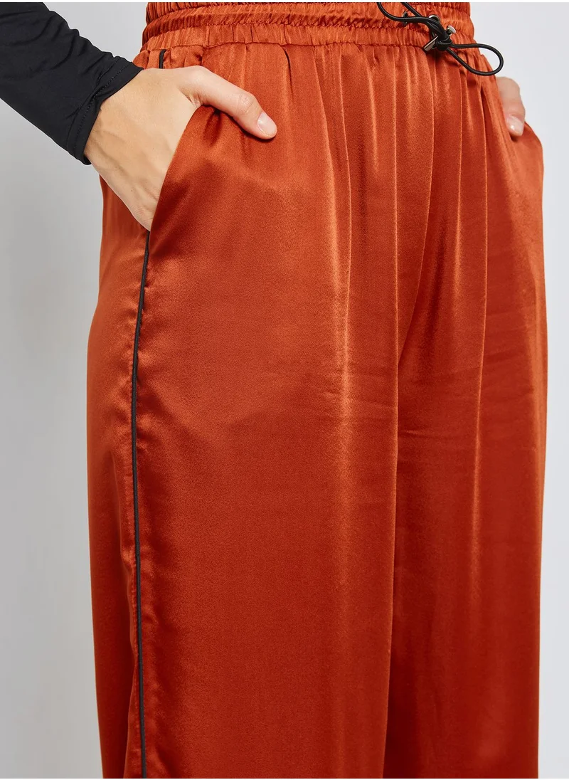 Ginger Ruffle Hem Satin Jogger Pants