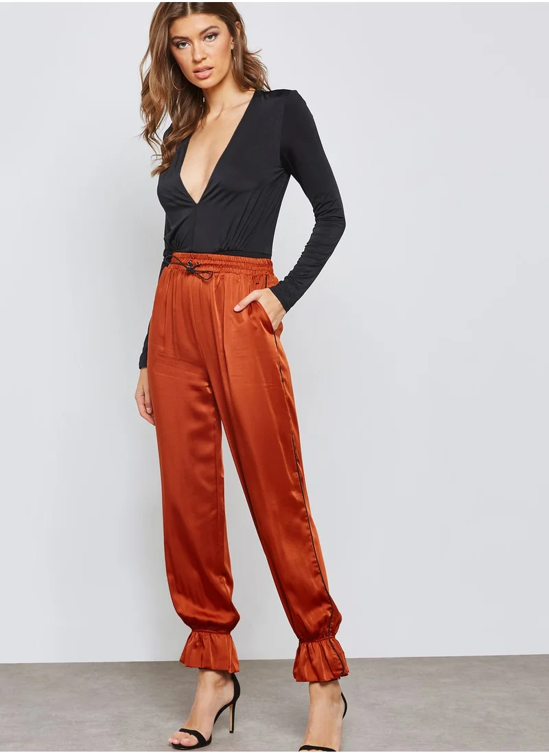 Ginger Ruffle Hem Satin Jogger Pants