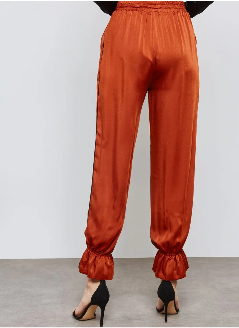 Ginger Ruffle Hem Satin Jogger Pants